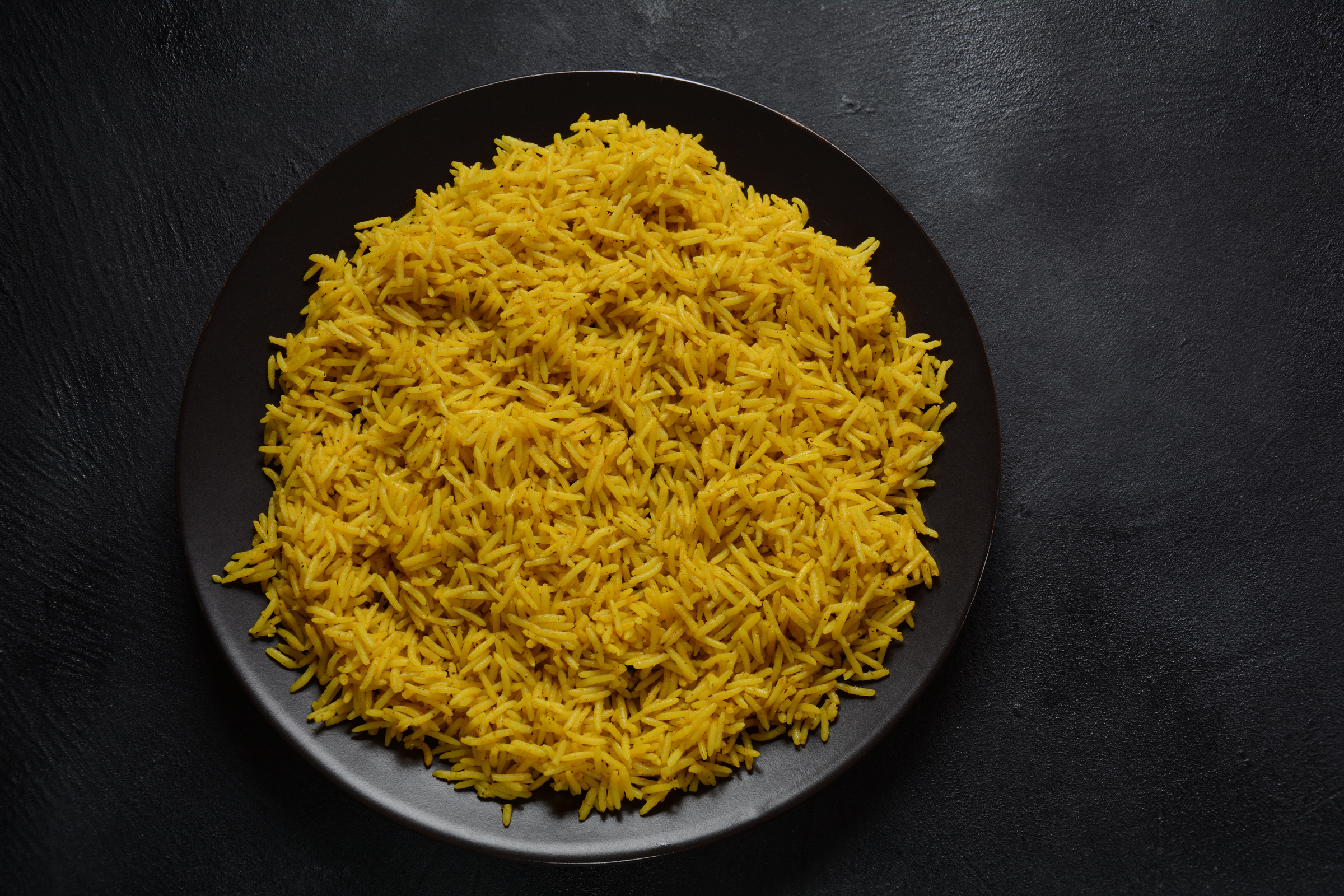 Yellow wild rice cooked with curcuma turmeric spice